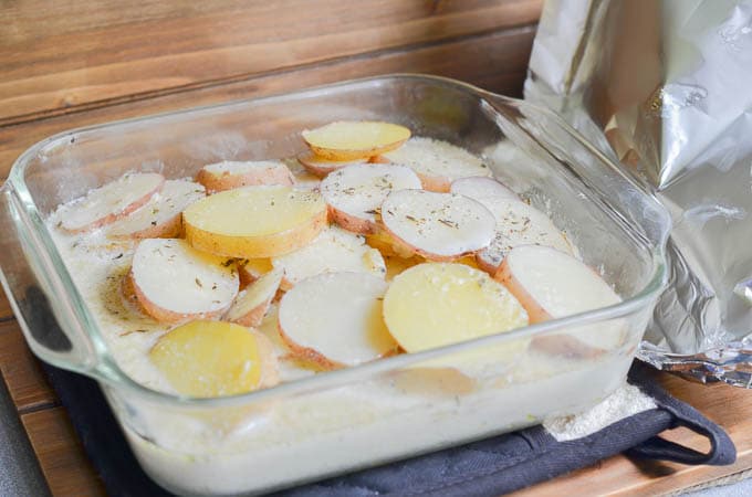 Scalloped potatoes without aluminum foil ready to go back into the oven.