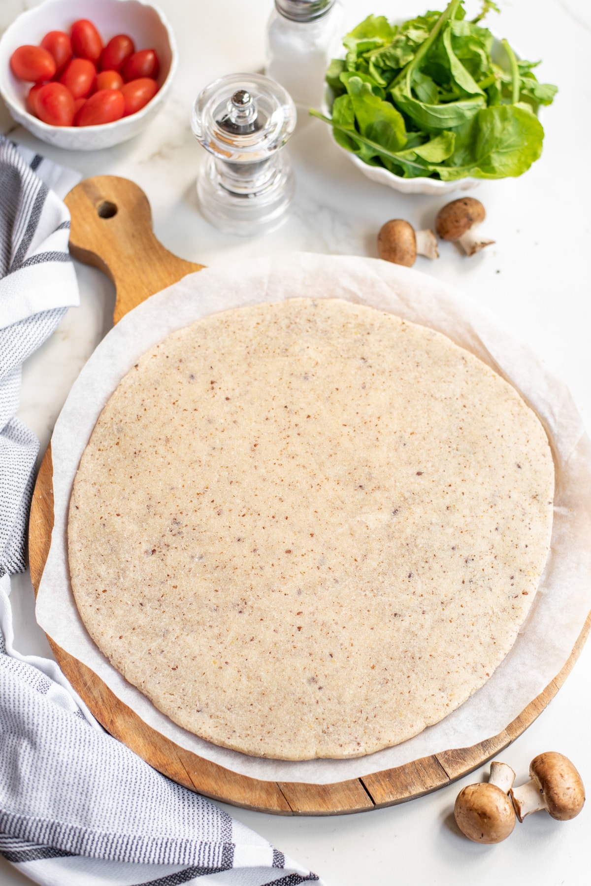 baked pizza crust on wooden board