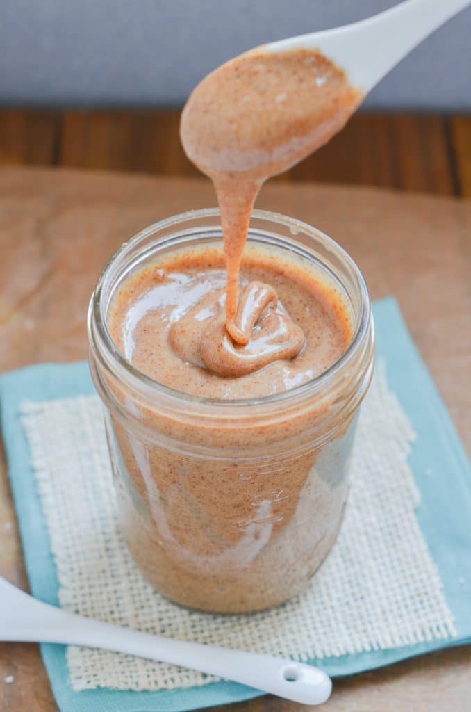 vegan caramel sauce in glass jar on counter.