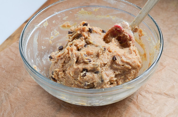 vegan cookie dough in glass mixing bowl.