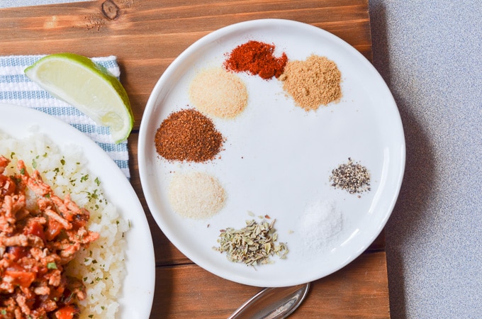 Whole30 spices on a round plate.