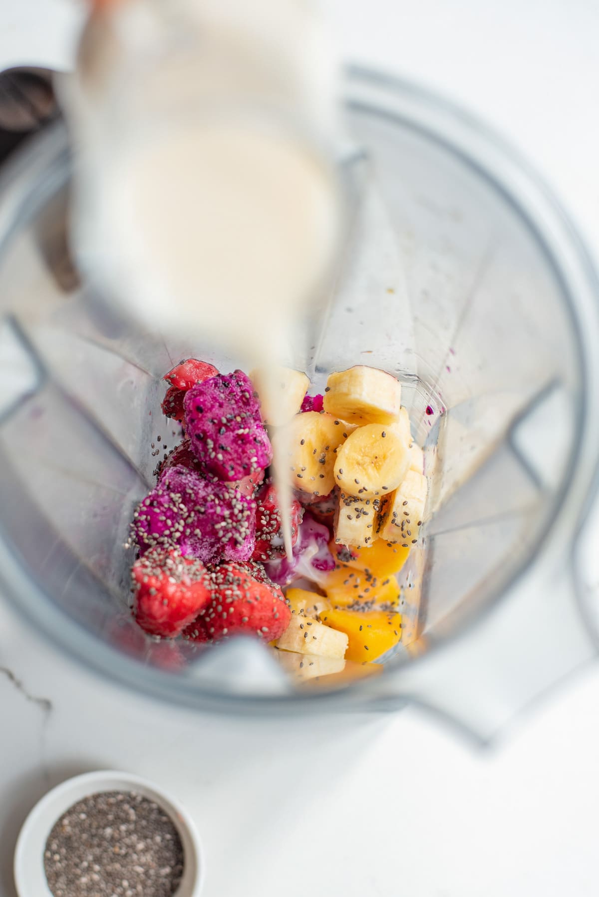 ingredients for dragon fruit smoothie in a blender.