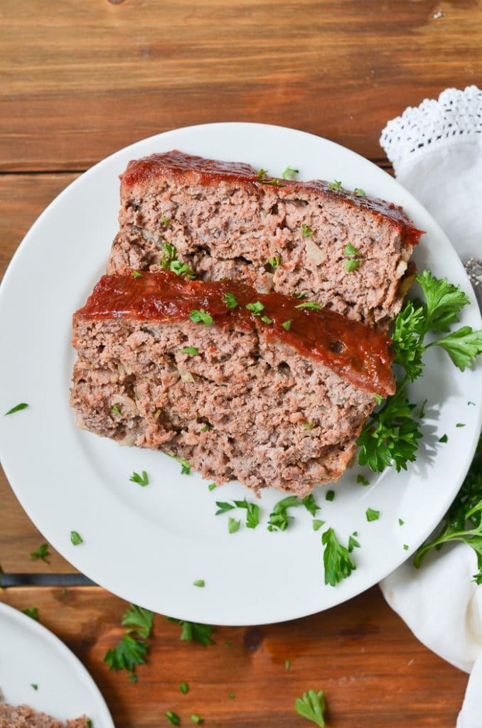 two slices of meatloaf on a plate.