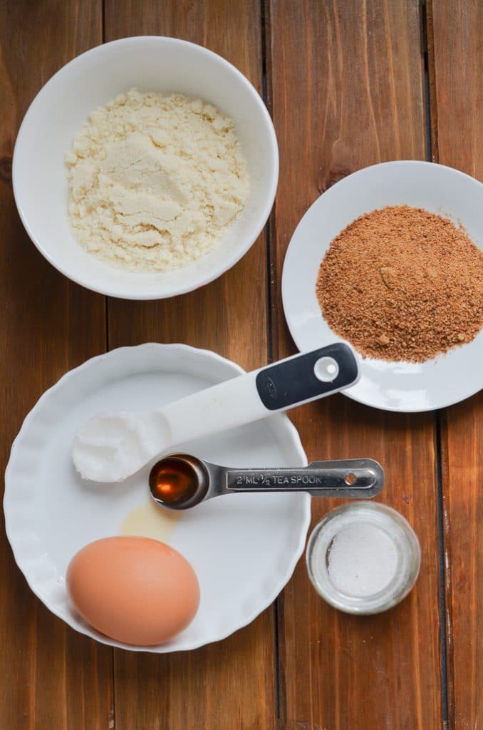 ingredients for Paleo mug cake in bowls on counter.