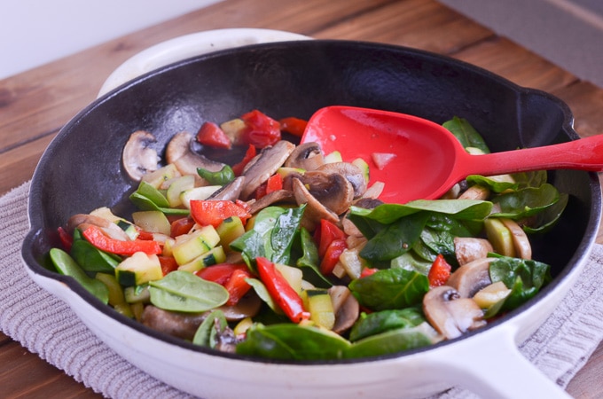 cooked veggies in cast iron skillet.