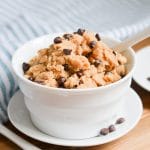 edible cookie dough in bowl with spoon.