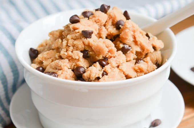 edible cookie dough in bowl with spoon.
