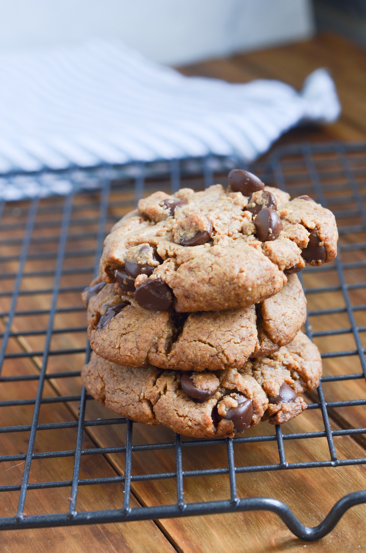 peanut butter chocolate chip cookies in a stack on cooling rack.