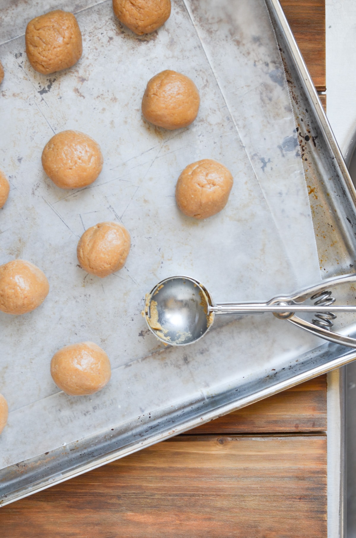 peanut butter balls on cookie sheet lined with wax paper.