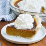 pumpkin pie slice on plate.