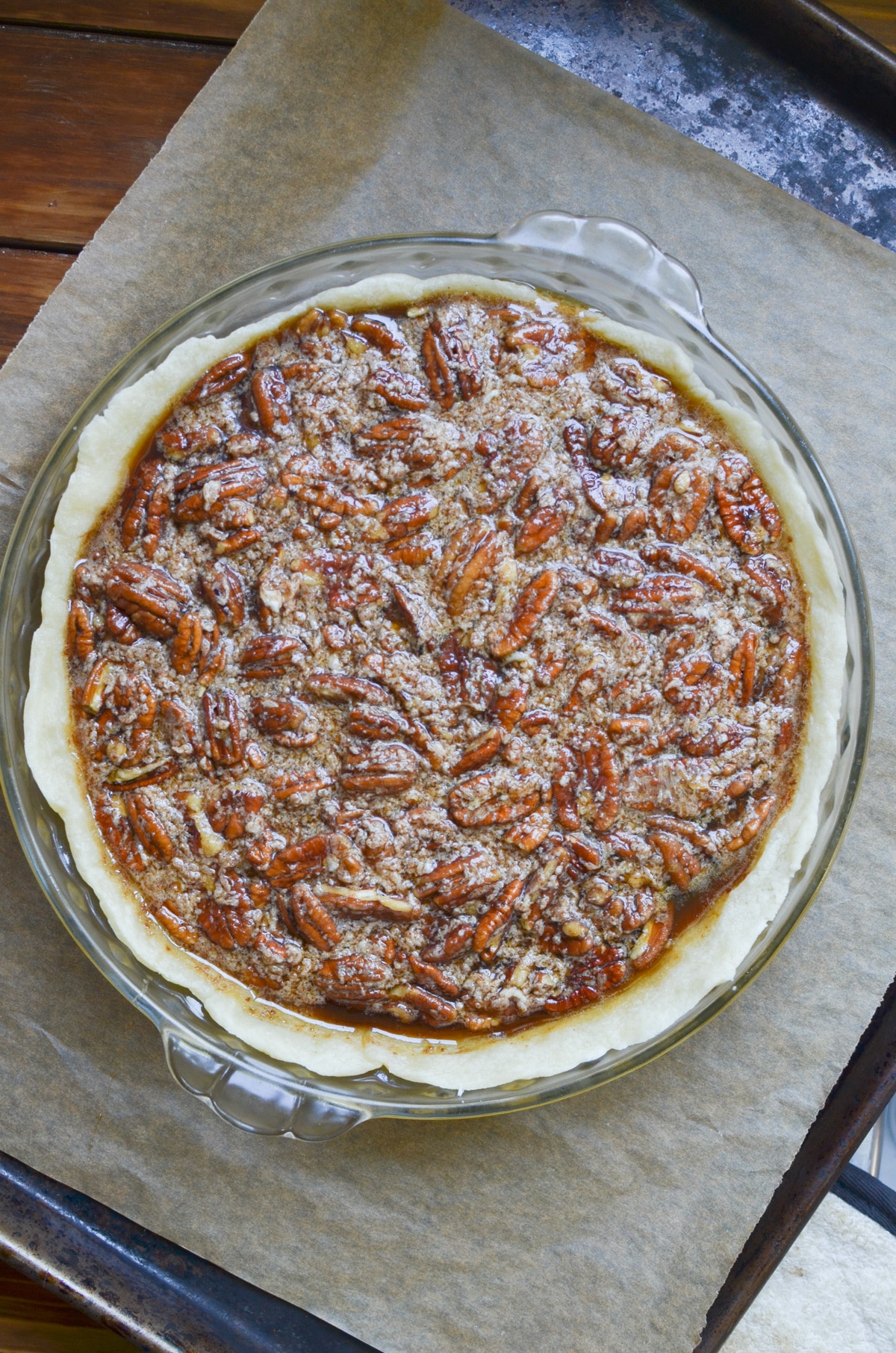 pecan pie filling in pie crust.