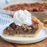 Slice of pecan pie on a plate.