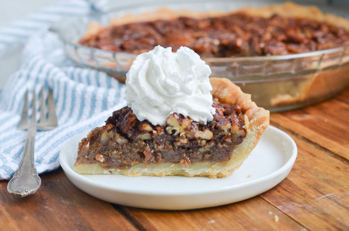 slice of maple pecan pie on a plate.