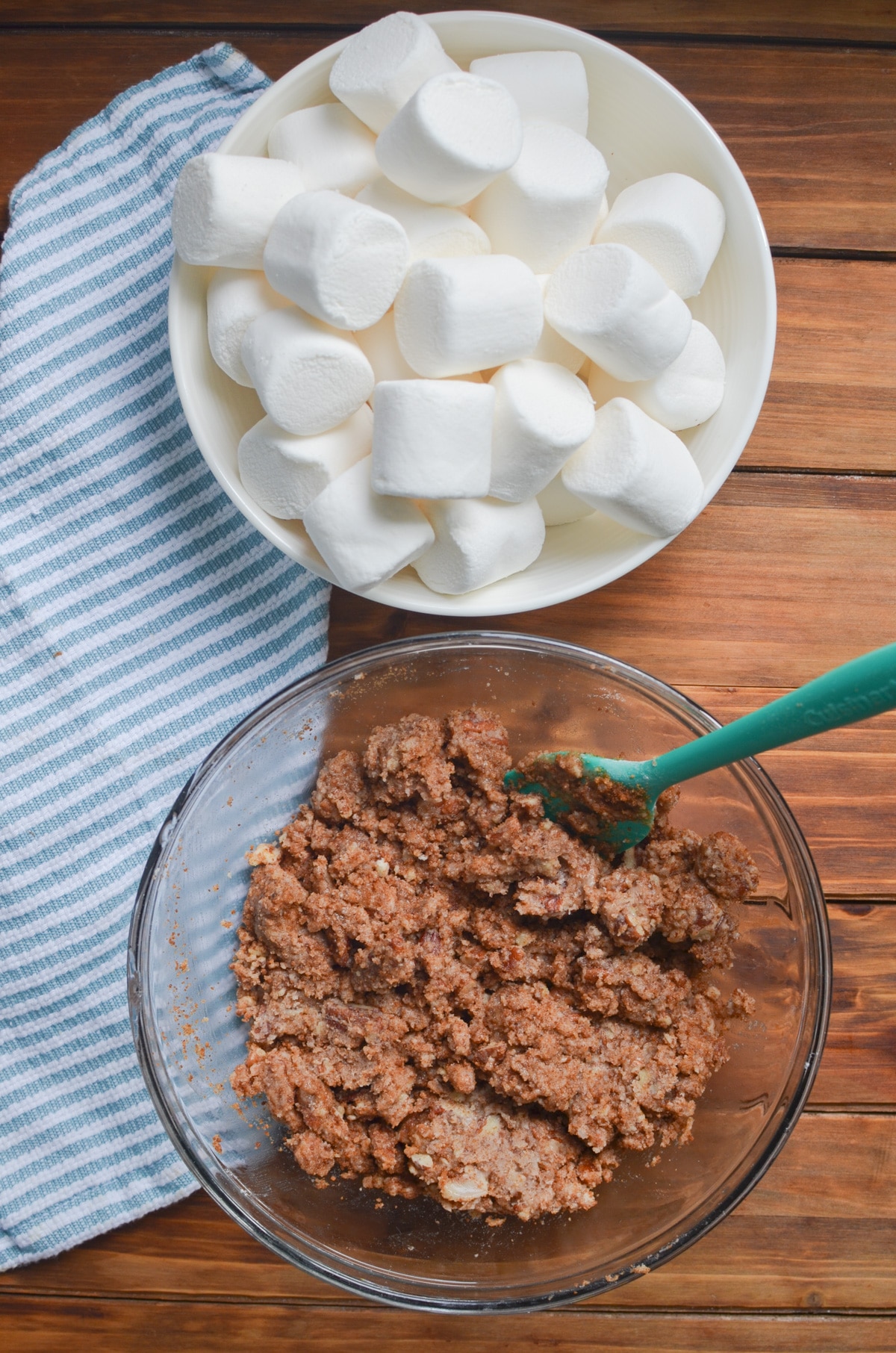 Streusel mixture in bowl and a bowl of marshmallows.