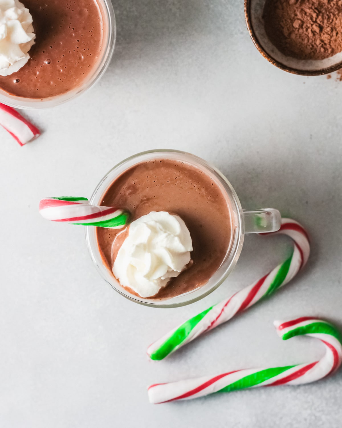 hot chocolate in mug with whipped cream.