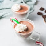 hot chocolate in mug with whipped cream.