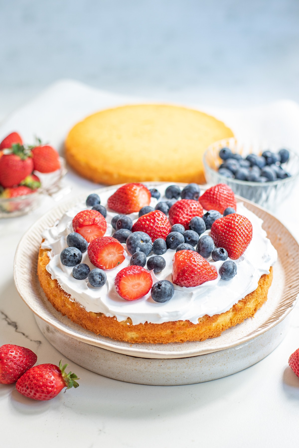 one layer of cake with whipped cream and berries.