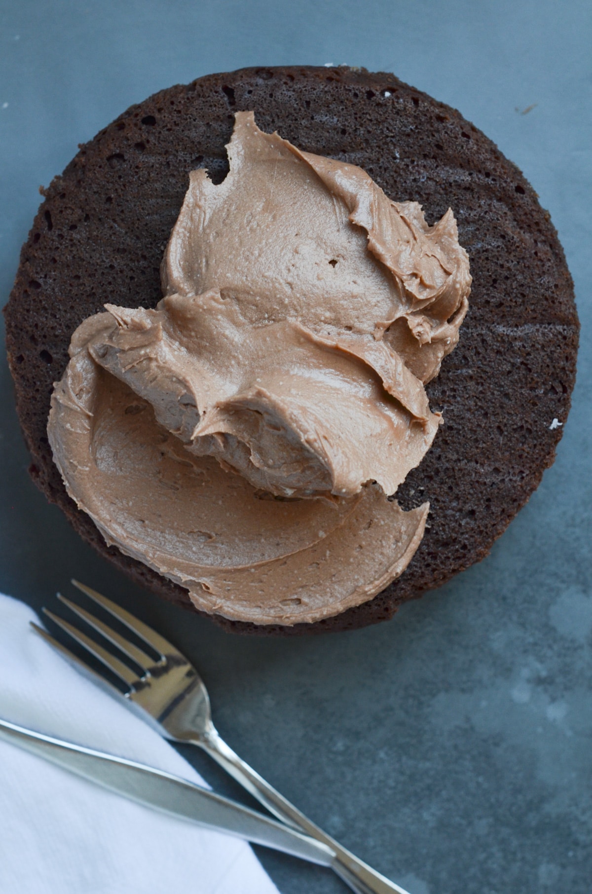 chocolate cake with scoop of chocolate frosting.