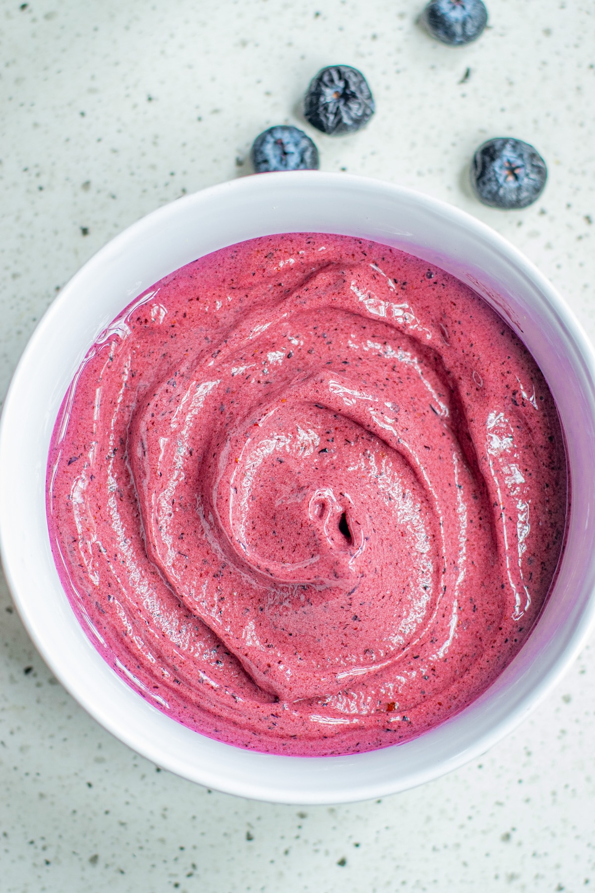 blueberry smoothie in white bowl.